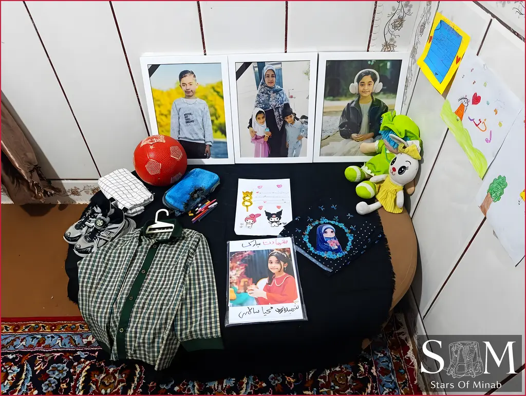 A memorial desk in the home of Mahya and Ali Salari featuring their belongings