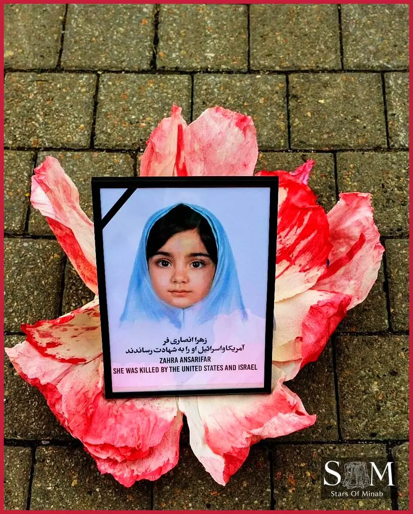 Toronto minab memorial portrait of a Zahra Ansarifar placed on a flower honoring her memory